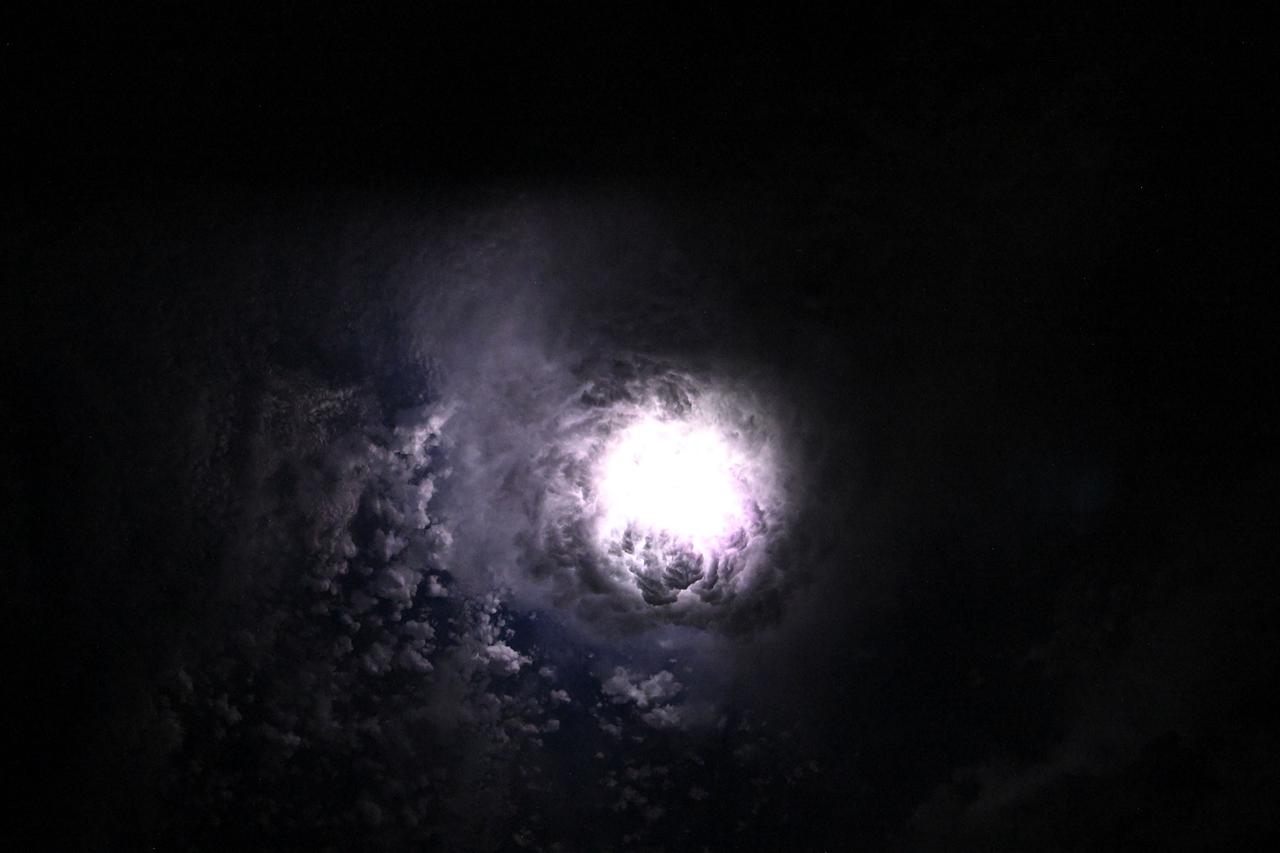 Lightning illuminates the clouds during a storm off the co