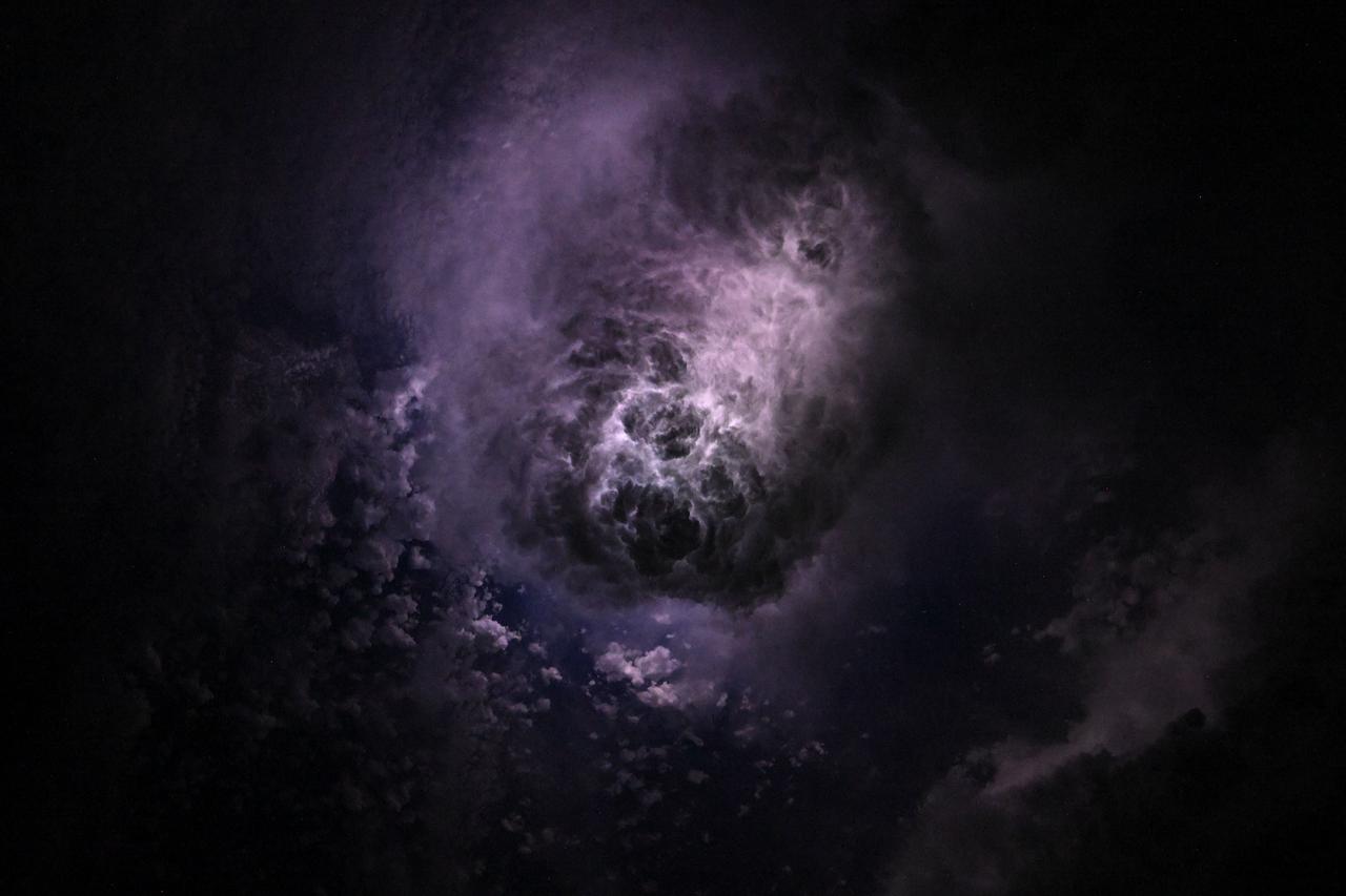 Lightning illuminates the clouds during a storm off the co