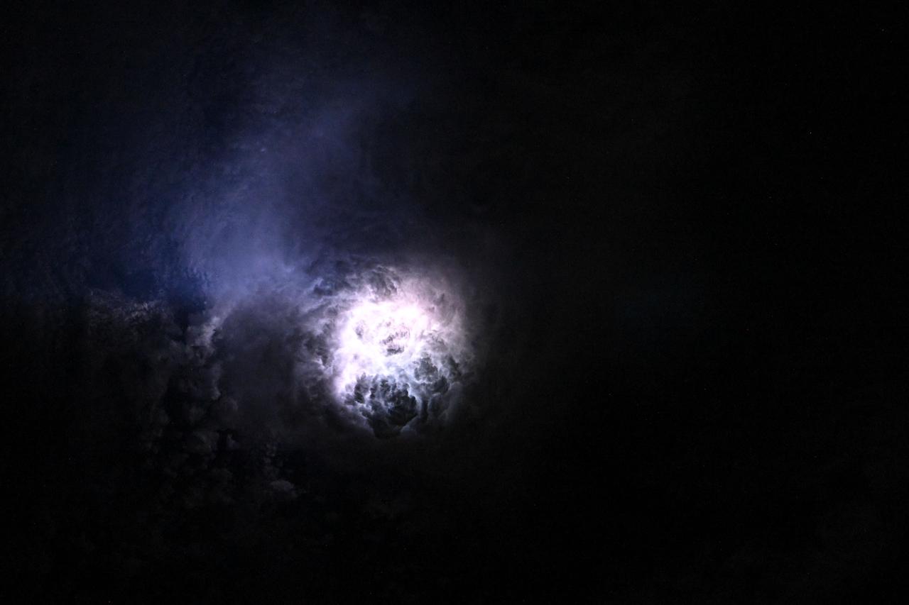 Lightning illuminates the clouds during a storm off the co