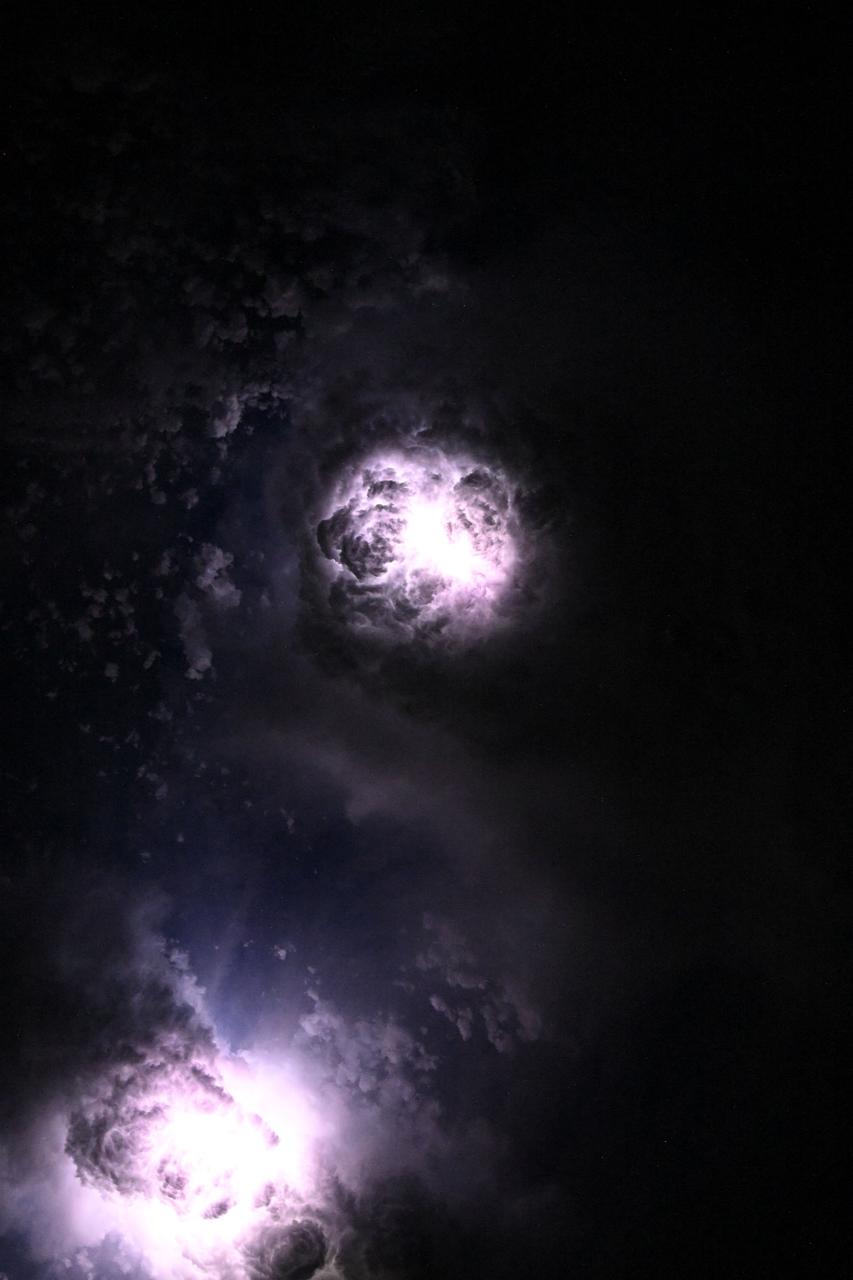 Lightning illuminates the clouds during a storm off the co